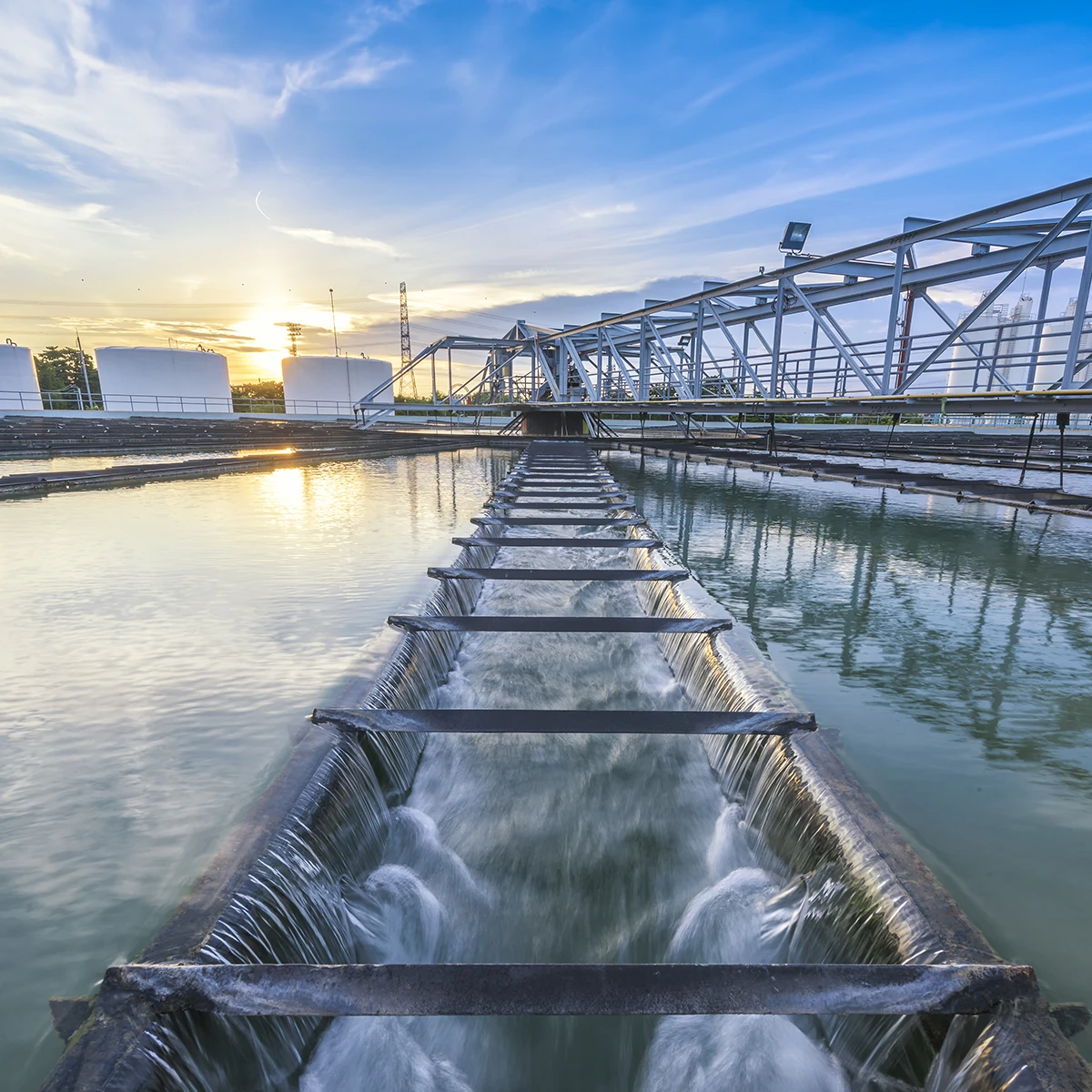 Water flows through an open air wastewater treatment tank in New Zealand