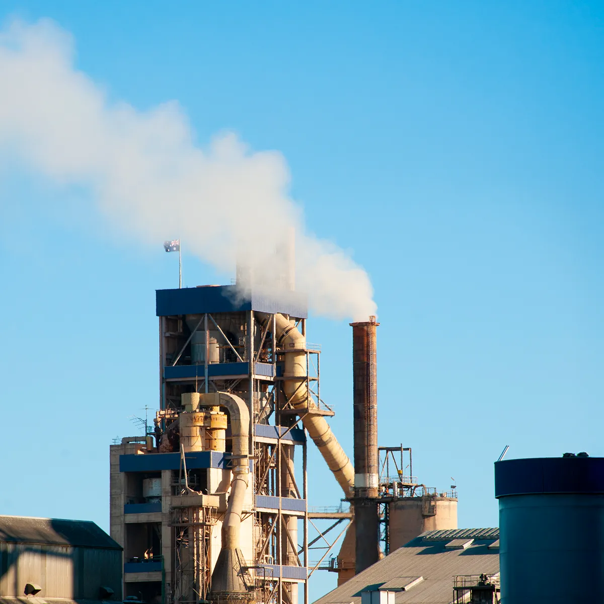 Cement industrial facility with a harmonic mitigration solution designed to reduce wear and tear on motors