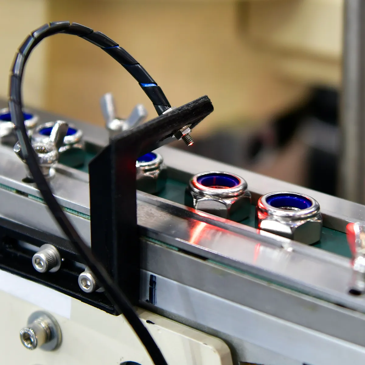 Visual camera sensor in use on a manufacturing conveyor belt to ensure everything is in the correct position.