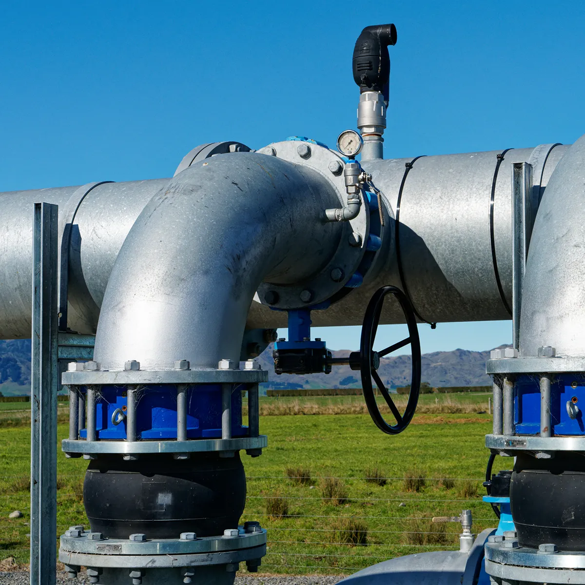 Pipes with installed valve solutions for an irrigation system on a New Zealand farm.