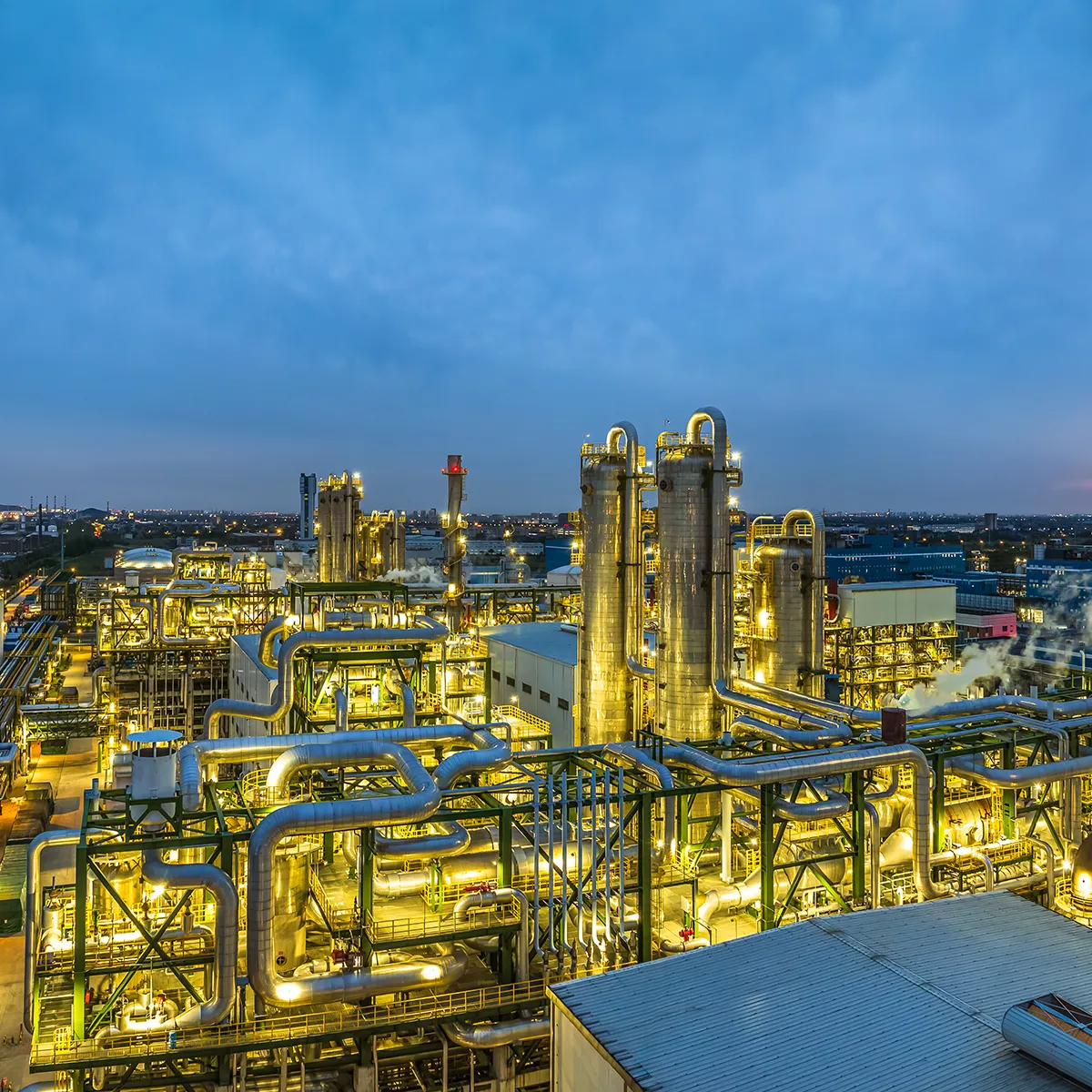 Chemical plant lit up at dusk